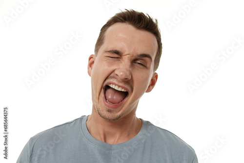 portrait of young happy man winking looking at the camera on white background