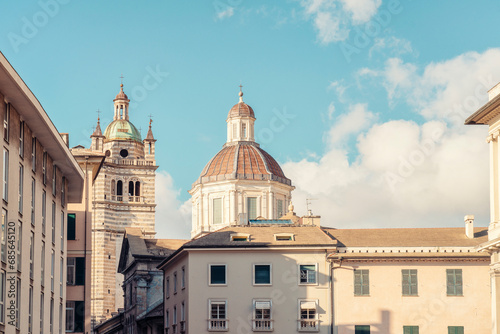 Italy, Liguria, Genoa, Metropolitan Cathedral of Saint Lawrence with house in foreground photo