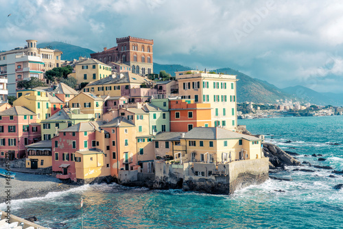 Italy, Liguria, Genoa, Pastel colored houses in Boccadasse district photo