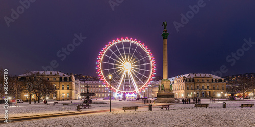 Germany, Baden-Wurttemberg, Stuttgart, Ferris wheel glowing at Schlossplatz square at night