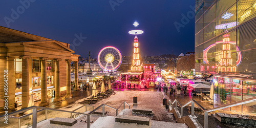 Germany, Baden-Wurttemberg, Stuttgart, Schlossplatz at winter night with Ferris wheel and Christmas market in background photo