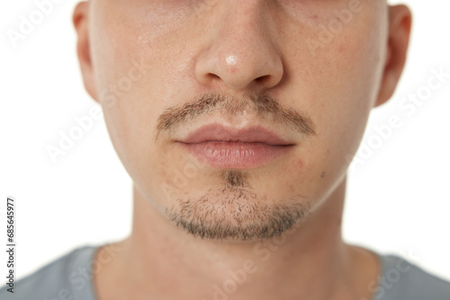 Close up of male nose on white studio background