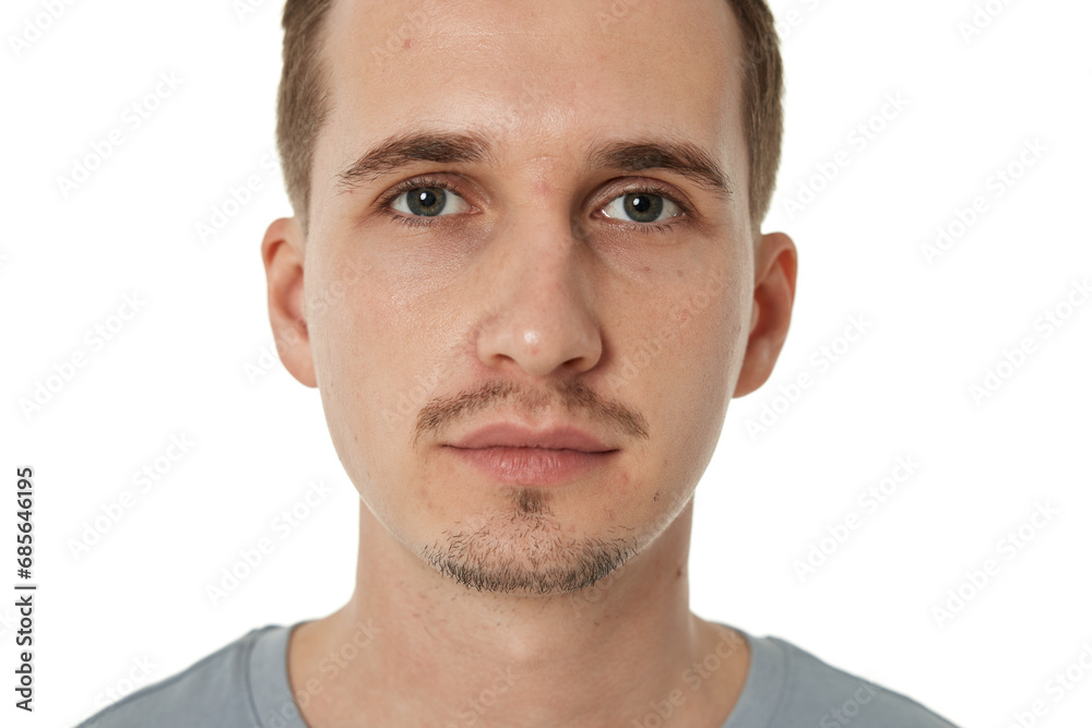 Fototapeta premium portrait of young calm man on white background