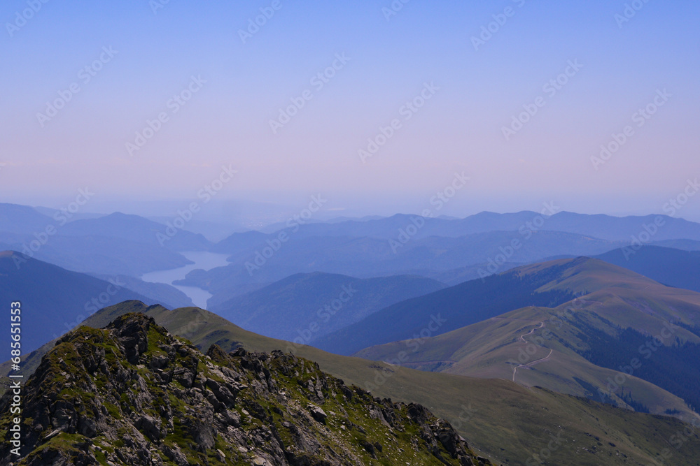 Glacial lake in the Carpathian mountains. The Vidraru dam seen from a great distance