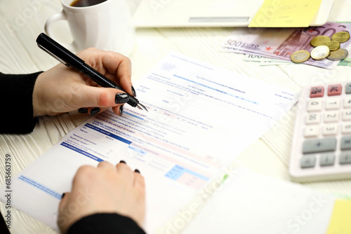 Accountant fill french tax form CA12 Value added tax and similar taxes in end of tax period. Taxation and paperwork routine in France