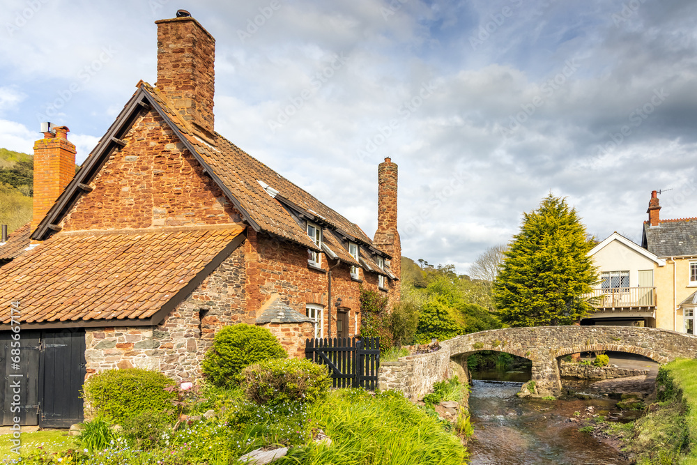The 15th-century packhorse bridge which spans the Aller Brook in the pretty village of Allerford on Exmoor National Park in Somerset. The 15th-century packhorse bridge which spans the Aller Brook in the pretty village of Allerford on Exmoor National Park in Somerset.