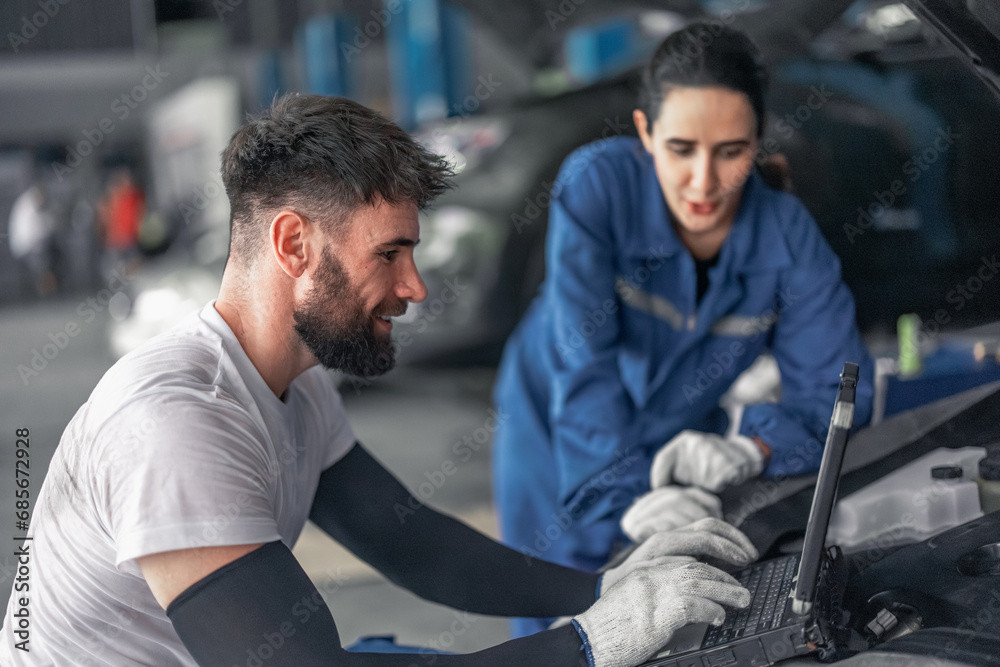 Car technician use computerized diagnostic to analyze, fix, repair engine, ensuring top performance