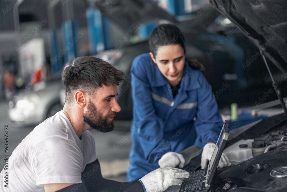 Car technician use computerized diagnostic to analyze, fix, repair engine, ensuring top performance Car technician use computerized diagnostic to analyze, fix, repair engine, ensuring top performance