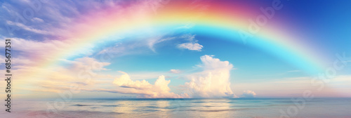 Seven-colored rainbow and clouds. Color scheme illustration in bright and pale colors. A panorama for banners suitable for hopes, desires, and wishes that will make your hopes and happiness come true. © omune