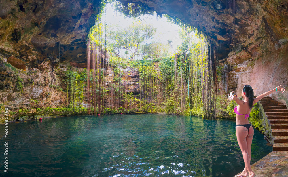 Ik-Kil Cenote - Lovely cenote in Yucatan Peninsulla with transparent waters and hanging roots. Chichen Itza, Mexico Ik-Kil Cenote - Lovely cenote in Yucatan Peninsulla with transparent waters and hanging roots. Chichen Itza, Mexico