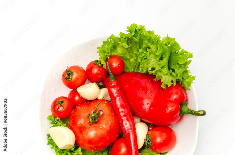Mix of fresh vegetables - garlic, tomatoes, cherries, chili, sweet pepper in drops of water. Mix of fresh vegetables - garlic, tomatoes, cherries, chili, sweet pepper in drops of water.