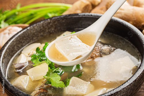 Chinese cuisine: crucian carp tofu soup photo