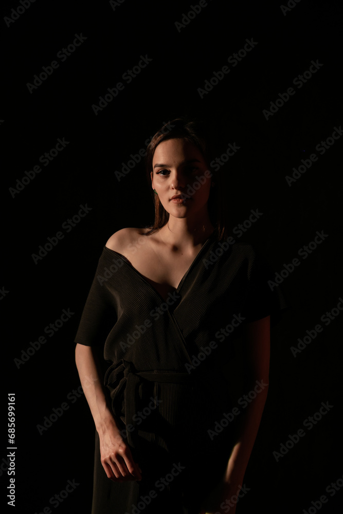 Portrait of a beautiful young woman in black clothes at night Portrait of a beautiful young woman in black clothes at night