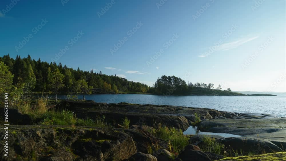 Early Morning On Coast Of Beautiful Lake In Northern Europe, Soft Sunshine On Shore And Pine Forest Early Morning On Coast Of Beautiful Lake In Northern Europe, Soft Sunshine On Shore And Pine Forest