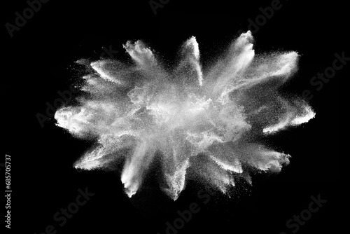 White powder explosion on black background. Colored cloud. Color dust explode. Paint Holi