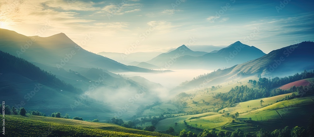 Beautiful sunrise in the mountains nature view from Kolukkumalai Munnar Kerala concept image Copy space image Place for adding text or design - obrazy, fototapety, plakaty 