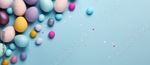 Colorful handcrafted Easter eggs on blue backdrop Minimalistic concept Top down perspective Text space on card Copy space image Place for adding text or design