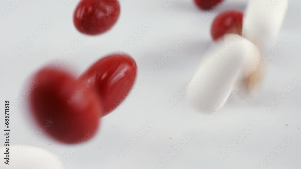 Falling tablets and pills. Medicine and healthy. Close up of capsules. Falling tablets and pills. Medicine and healthy. Close up of capsules.
