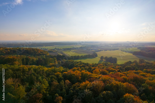 Serene autumnal panorama, european village, fields, and forest from a drone's eye view © mimacz