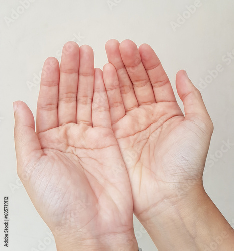 Palms up or praying hand, pray to God. Hand gesture for symbol in religion