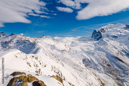 Snowy landscape of the Gornerglestcher, Valais, Switzerland on a cold sunny winter morning