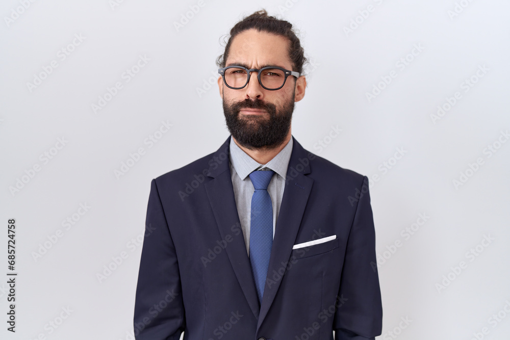 Hispanic man with beard wearing suit and tie skeptic and nervous, frowning upset because of problem. negative person. Hispanic man with beard wearing suit and tie skeptic and nervous, frowning upset because of problem. negative person.