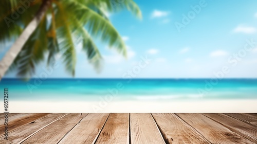 a wooden table with a blurry beach and blue water