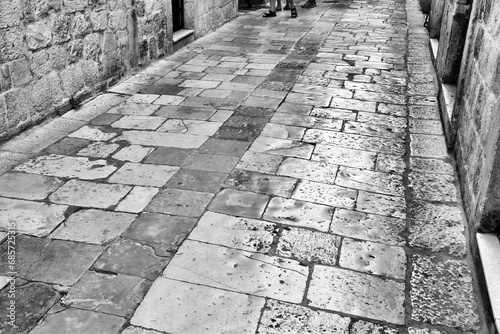 Dubrovnik polished stones in Croatia. Black and white photo retro style.