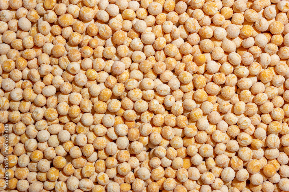 Uncooked Yellow Polished Peas Background. A Culinary Canvas of Dry Yellow Peas, Creating a Lively and Textured Background for Gourmet Cooking. Scattered Raw Polished Peas. Healthy Eating Ingredients Uncooked Yellow Polished Peas Background. A Culinary Canvas of Dry Yellow Peas, Creating a Lively and Textured Background for Gourmet Cooking. Scattered Raw Polished Peas. Healthy Eating Ingredients