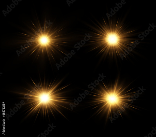 Shining golden stars isolated on black background. The star burst with brilliance. Glow effect.