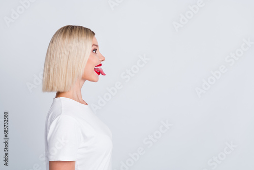 Canvas Print Profile side photo of positive glad funny girl showing tongue looking empty spac