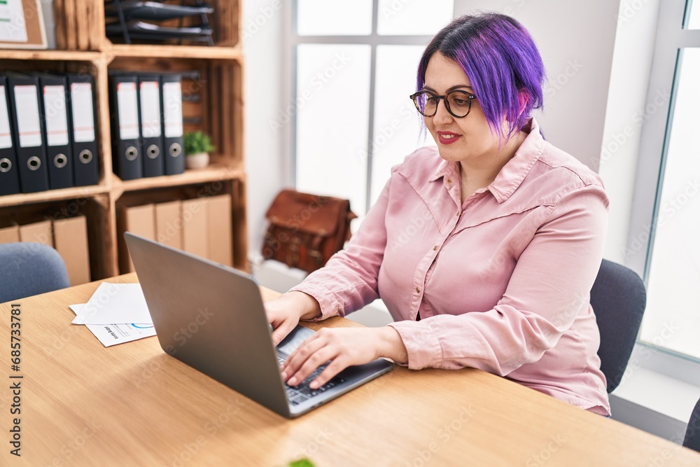 Young beautiful plus size woman business worker using laptop working at office Young beautiful plus size woman business worker using laptop working at office