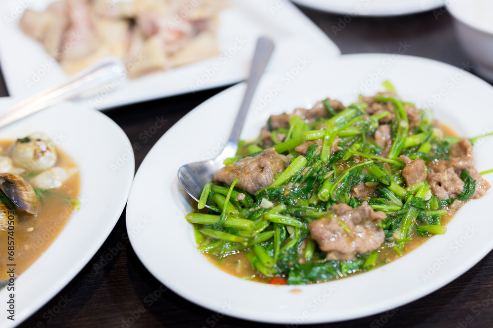 Fry beef with vegetable dish in restaurant Fry beef with vegetable dish in restaurant