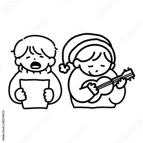 Little boy singing and playing guitar in Christmas Day 