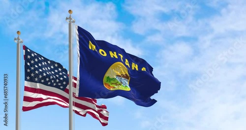 Montana state flag waving in the wind with the American flag on a clear day photo