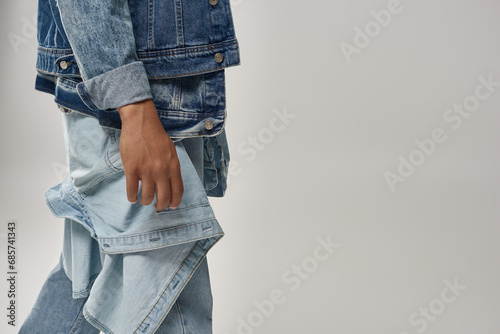 cropped view of stylish african american male model posing in trendy denim outfit, fashion concept photo