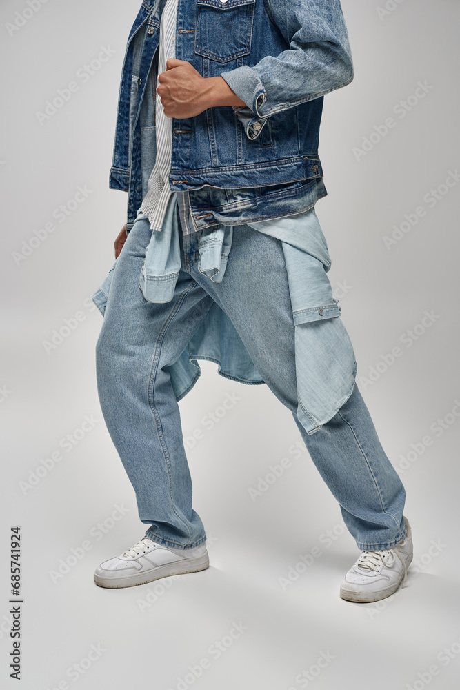 cropped view of stylish african american male model posing in trendy denim outfit, fashion concept cropped view of stylish african american male model posing in trendy denim outfit, fashion concept