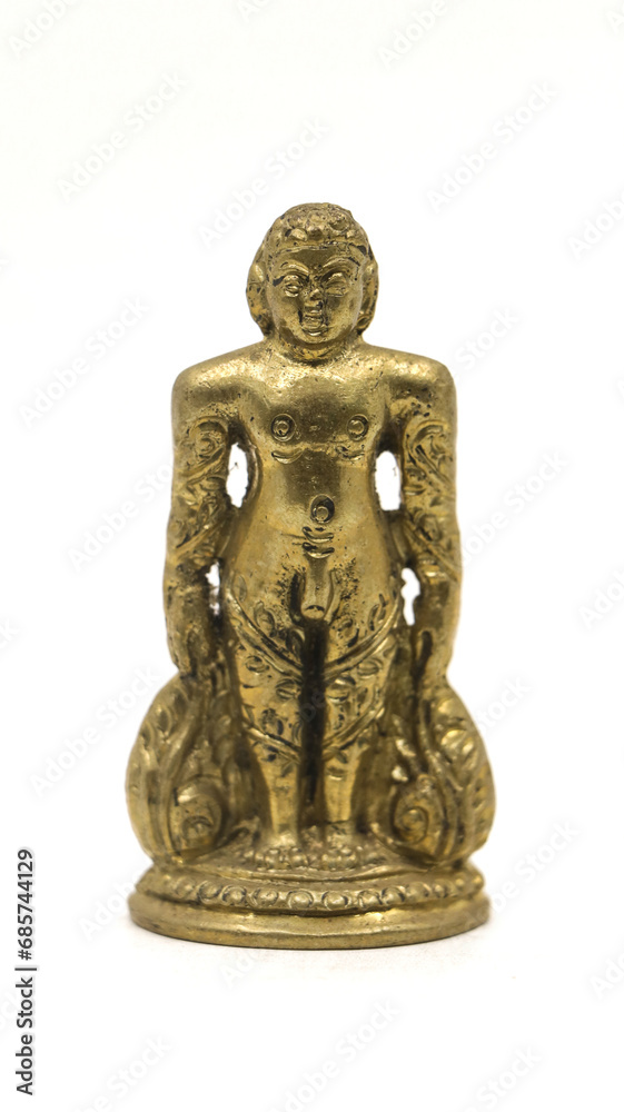 golden jain bahubali statue from a handcrafted collection from an antique shop isolated in a white background golden jain bahubali statue from a handcrafted collection from an antique shop isolated in a white background