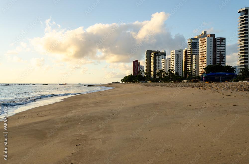 Apartment Buildings are mirroring at the Beach of Candeias early in the morning, just after sunrise. 