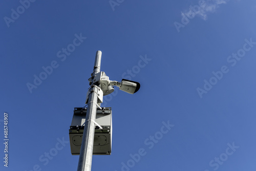 A pole with surveillance cameras with electrical energy accumulators