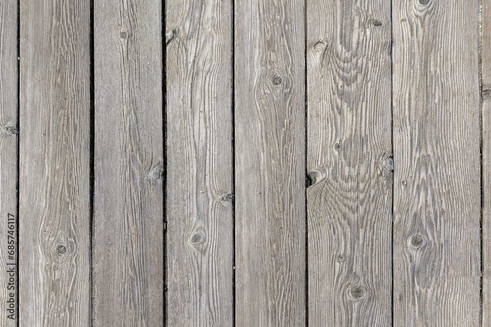 A grayish unvarnished wooden plank floor with grains of sand on the surface. Vector wood texture background A grayish unvarnished wooden plank floor with grains of sand on the surface. Vector wood texture background