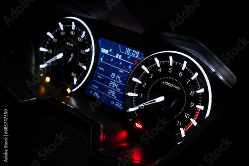 Light with car mileage with black background,number of speed,Odometer of car.