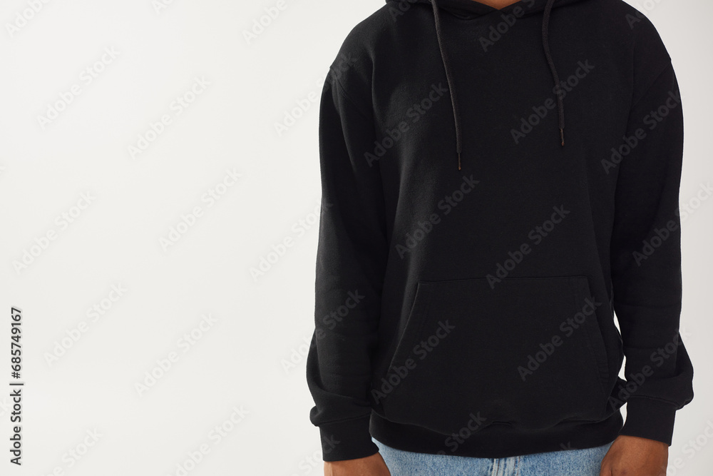 trendy african american male model in casual black hoodie and jeans, copy space for advertising