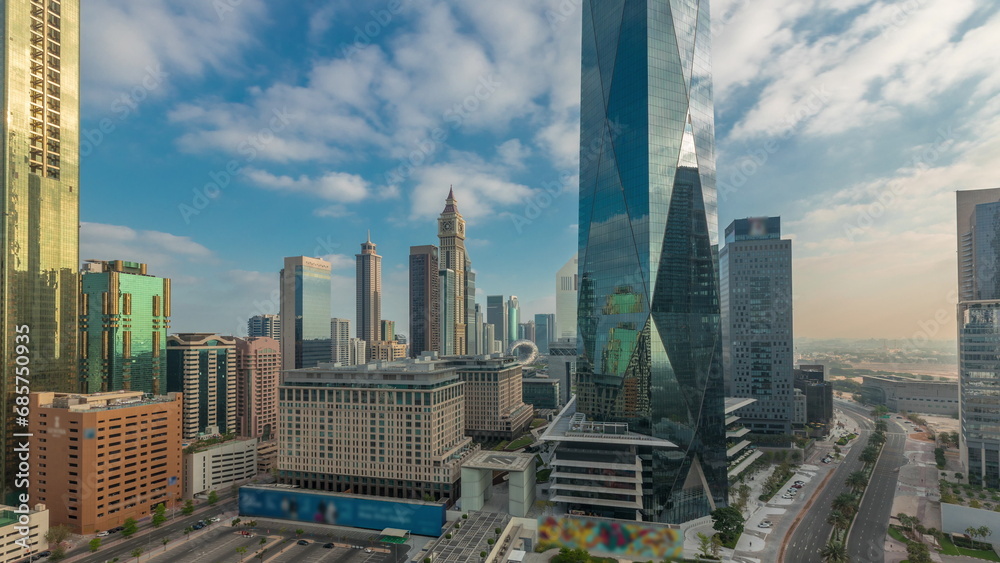 Obraz premium Dubai International Financial district aerial night to day timelapse. Panoramic view of business office towers.