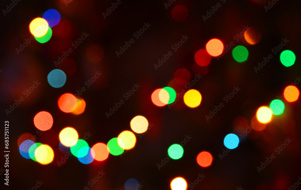 Abstract shiny colorful blurred bokeh background of Christmas garland lights.Soft focus.
Abstract shiny colorful blurred bokeh background of Christmas garland lights.Soft focus.