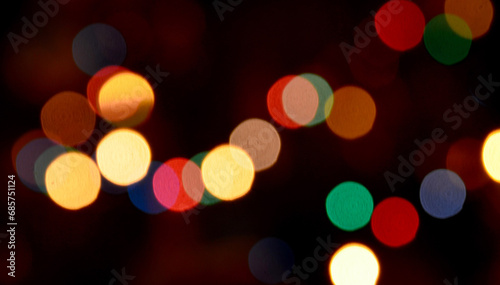 Abstract shiny colorful blurred bokeh background of Christmas garland lights.Soft focus. 