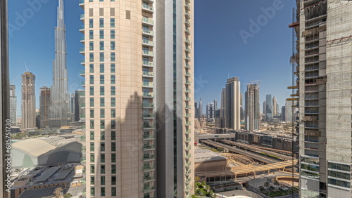 Tallest skyscrapers in downtown dubai located on bouleward street near shopping mall aerial timelapse.