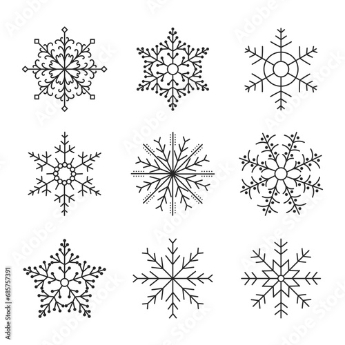 Set of hand drawn silhouettes of snowflakes on a white background. Winter design elements  vector