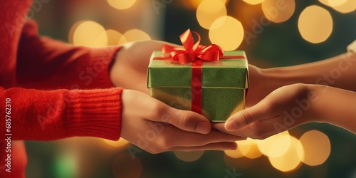 Close up woman giving an attractive young friend a surprise gift gift-wrapped with green paper and a bow to celebrate Christmas or New Year, generative ai