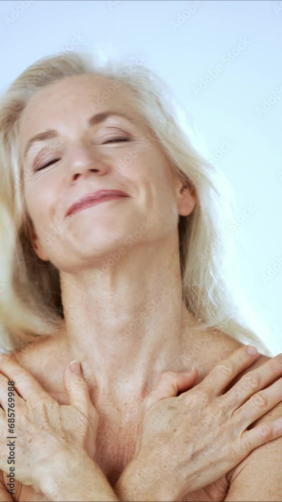 Vertical video portrait of happy smiling attractive mature nude woman